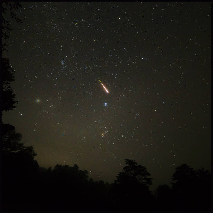 album artwork for 'Heliium', a photo of the stars from the woods - taken by Liquidtree.